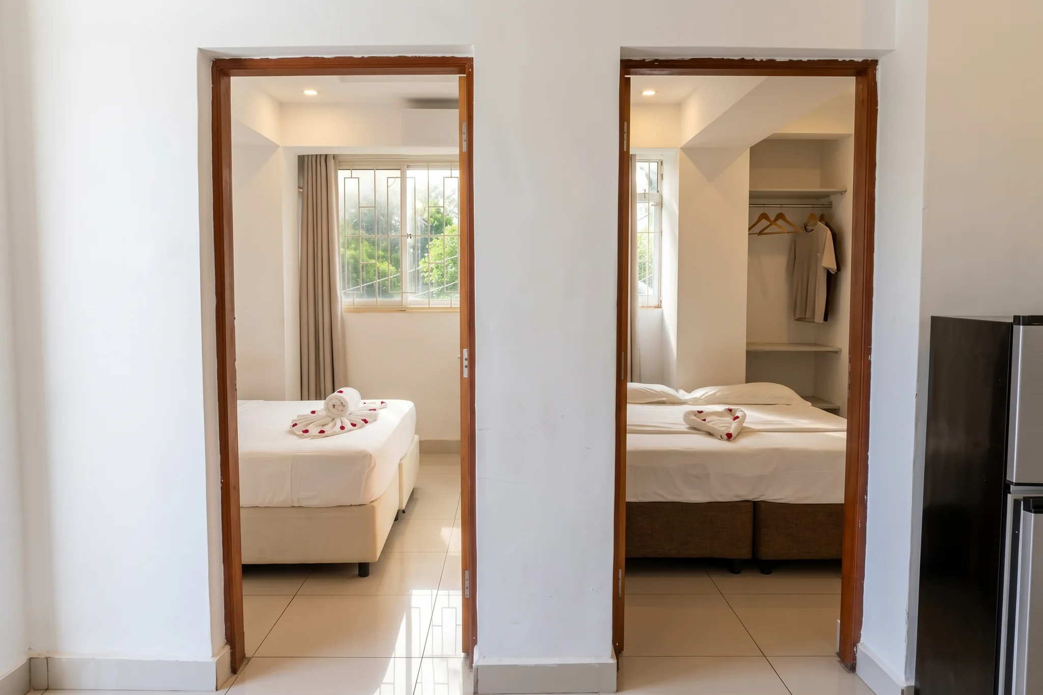 Interior hallway connecting living room to private bedrooms and bathroom