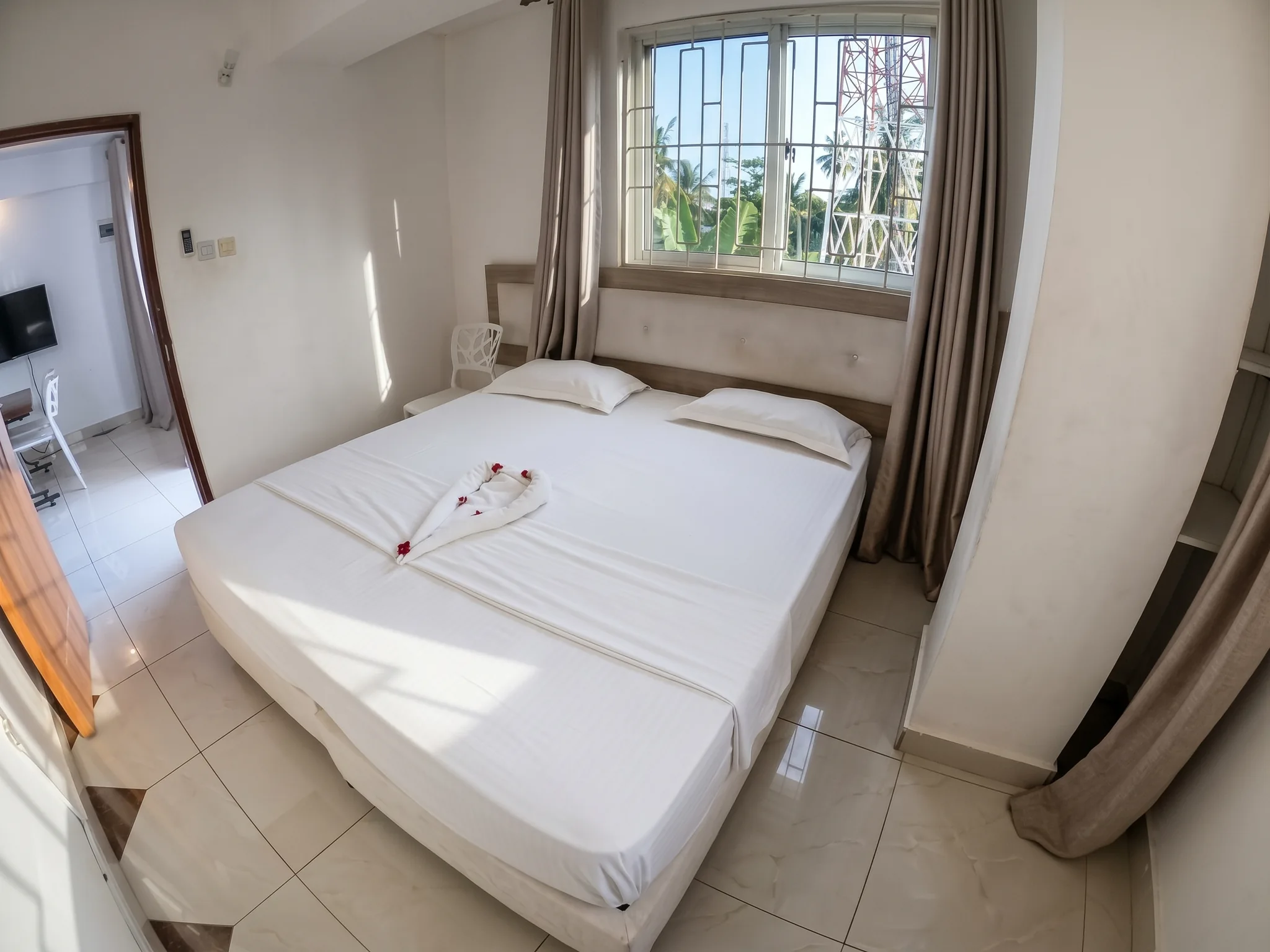 Bright master bedroom interior with wardrobe and window ventilation